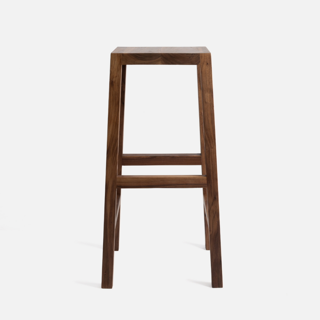 A walnut kitchen stool on a white background
