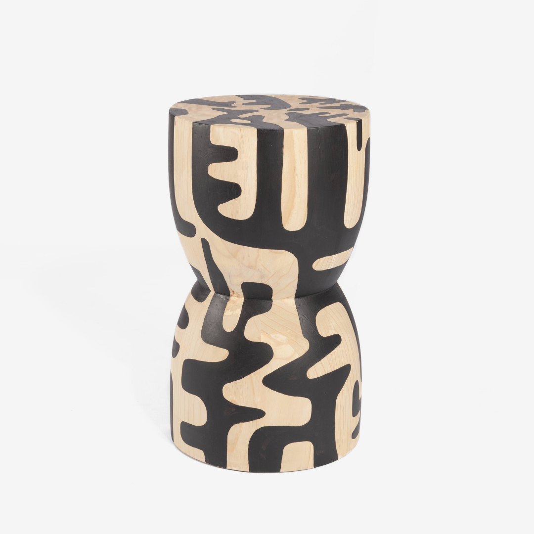 Decorative stool with black and beige abstract pattern on a white background