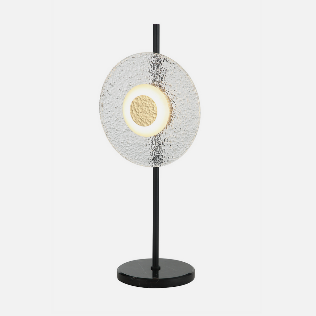 A steel and glass feature lamp that gives off a halo effect