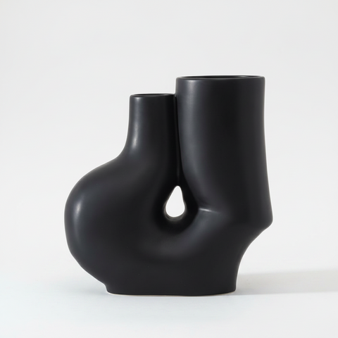 Black abstract vase on a white background