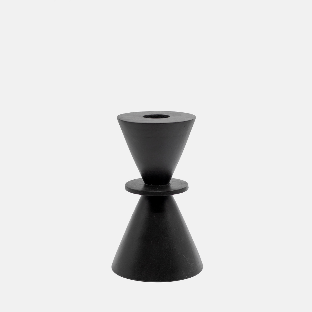 A minimalist black geometric candle holder with a dual-cone design, set against a solid light gray background.