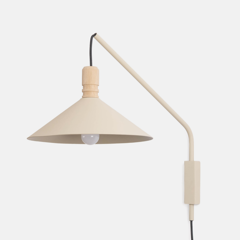 A modern wall sconce lamp with a conical shade, a curved arm, and a light oak collar, shown against a plain light gray background.